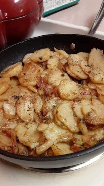 Skillet fried potatoes and onions golden and crispy