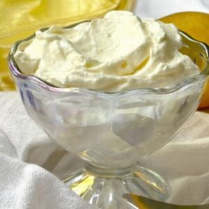 Lemon syllabub dessert cups topped with berries